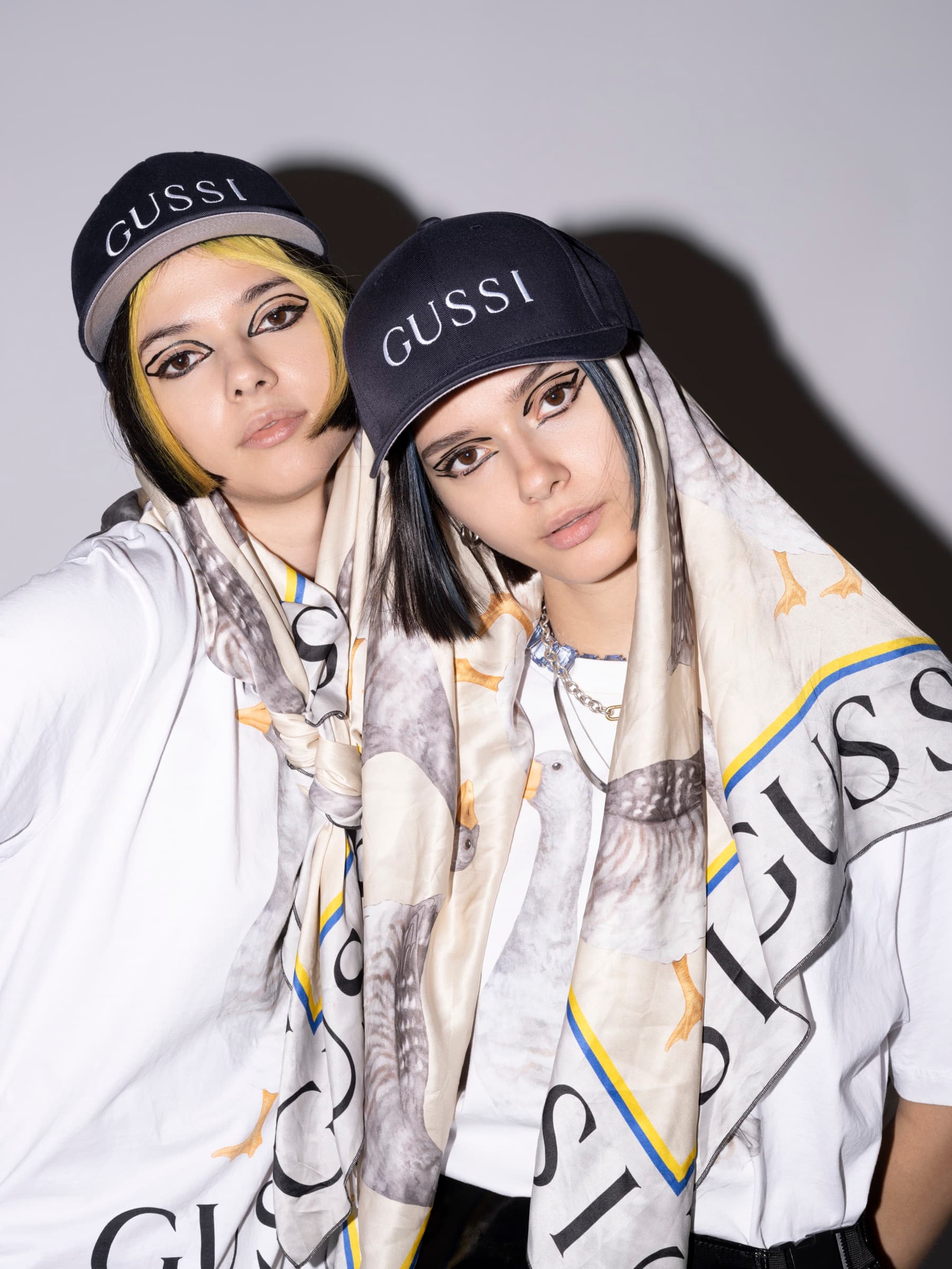 Bloom Twins wearing GUSSI goose-print silk